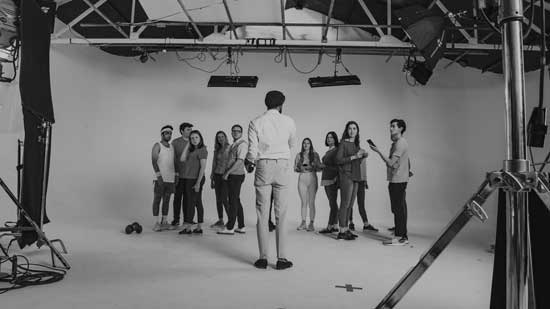 Sandeep directing a group of 15 actors on a soundstage